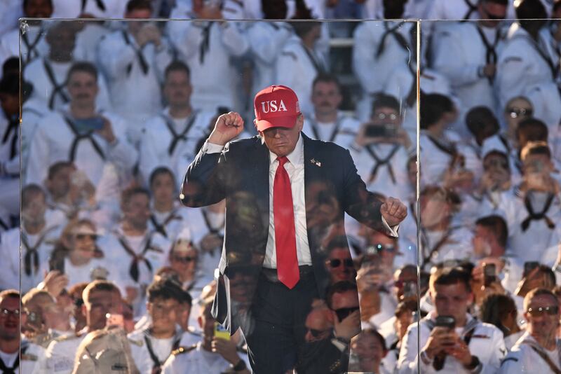 US President Donald Trump dances after delivering remarks during the US Navy's 250th anniversary celebration