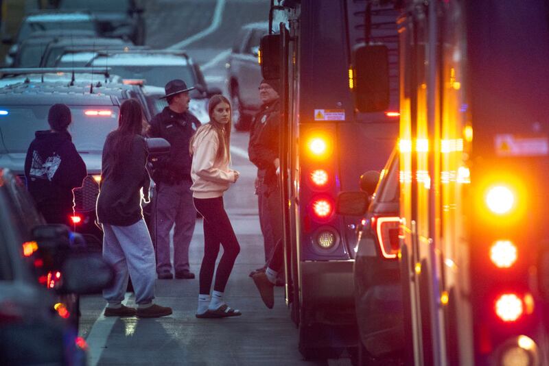 Students evacuate a church building near the site of a school shooting in Madison, Wisconsin.