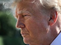 US President Donald Trump speaks to the media before boarding Marine One on the South Lawn of the White House in Washington, DC, on October 23, 2026. President Trump is travelling to Florida to speak at a midterm campaign rally. (Photo by Alex WROBLEWSKI / AFP via Getty Images)