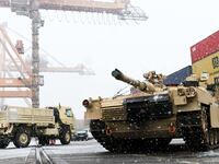 A M1A2 Abrams battle tank of the US army that will be used for military exercises by the 2nd Armored Brigade Combat Team, is unloaded at the Baltic Container Terminal in Gdynia on December 3, 2022.