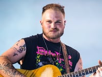 NASHVILLE, TENNESSEE - JUNE 29: Zach Bryan performs during the Quittin Time tour at Nissan Stadium on June 29, 2024 in Nashville, Tennessee. (Photo by Keith Griner/Getty Images)