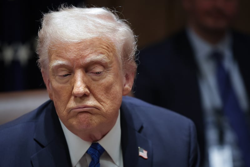 U.S. President Donald Trump listens to a reporter's question during an Ambassador Meeting in the Cabinet Room of the White House on March 25, 2025 in Washington, DC.