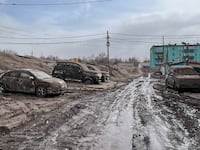 A view shows cars covered in volcanic dust following the eruption of Shiveluch volcano in the settlement of Klyuchi on the Kamchatka Peninsula, Russia April 11, 2023.
