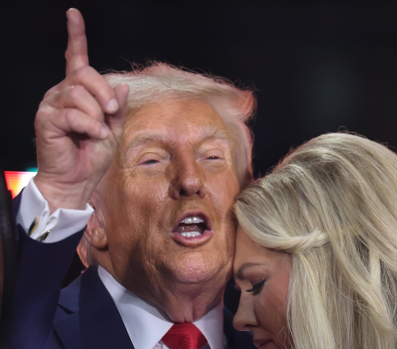 GLENDALE, ARIZONA - SEPTEMBER 21: Erika Kirk joins U.S. President Donald Trump onstage during the memorial service for political activist Charlie Kirk at State Farm Stadium on September 21, 2025 in Glendale, Arizona. Kirk, the CEO and co-founder of Turning Point USA, was shot and killed on September 10th while speaking at an event during his "American Comeback Tour" at Utah Valley University. (Photo by Win McNamee/Getty Images)