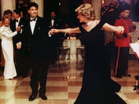 John Travolta dances with Princess Diana inside a White House ballroom.