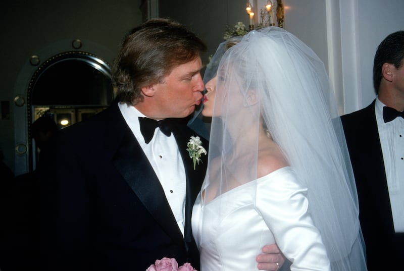 Donald Trump and Marla Maples pucker their lips for a kiss on their wedding day.