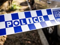 New South Wales (NSW) police tape can be seen across a road near the Russian consulate in Sydney on September 1, 2025.