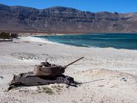 SOCOTRA ISLAND, YEMEN - OCTOBER 15: A Soviet tank lies in the sand on October 15, 2025 in Socotra, Yemen. Socotra, the largest island in an eponymous archipelago, lies 150 miles off the Horn of Africa, and even farther from mainland Yemen. Its relative isolation has mitigated the impact of Yemen's long-running and stalemated civil war, rendering it safe enough to attract a small but steady stream of foreign tourists. However, it has not been untouched by regional hostilities. In recent years, the UAE-backed secessionist group Southern Transitional Council wrested control of the island from the Saudi-backed internationally recognized government. The STC ultimately joined the government's Presidential Leadership Council, but the UAE retains considerable military and economic influence in the archipelago. (Photo by Carl Court/Getty Images)