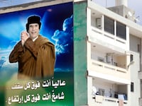 articles/2011/02/19/libya-fights-protests-with-deadly-crackdown/lamen-libya-qaddafi_161295_d5sipc