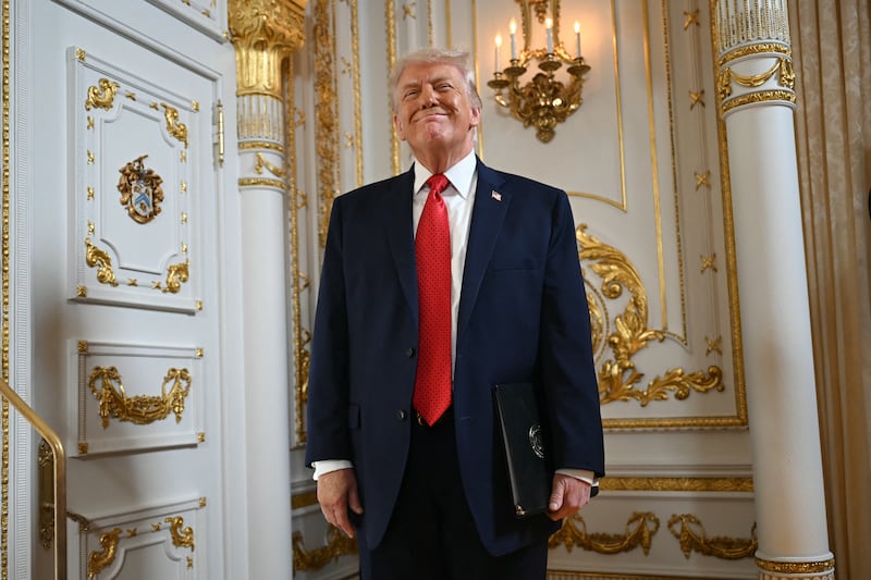 Donald Trump reacts as he arrives at a dedication ceremony for Southern Boulevard, in the ballroom at Mar-a-Lago in Palm Beach, Florida