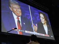 A screen displays the presidential debate hosted by ABC between Republican presidential nominee, former U.S. President Donald Trump and Democratic presidential nominee, U.S. Vice President Kamala Harris in Philadelphia, Pennsylvania