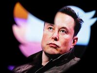 Elon Musk is seen in a Twitter logo