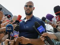 Andrew Tate delivers a press statement outside his house in Voluntari, Ilfov, Romania, August 4, 2023.
