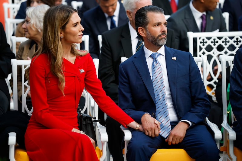 Donald Trump Jr. (R) sits with his girlfriend Bettina Anderson prior to a Presidential Medal of Freedom ceremony in the Rose Garden of the White House on October 14, 2025 in Washington, DC.