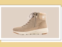 Beige suede lace-up winter boot with sherpa cuff and white Ultra Go sole, displayed on neutral background.