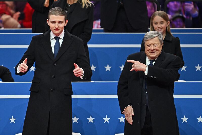 Barron Trump his grandfather Viktor Knavs attend the inaugural parade.