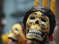 articles/2014/11/01/america-s-fastest-growing-death-holiday-is-from-mexico/141031-schulson-santa-muerta-tease_o2rczn