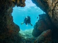 A scuba diver explores underwater caves and caverns off the coast of Kusadasi in Aydin, Turkiye on September 17, 2026. The coastal area, known for its unique natural rock formations and vibrant marine life, attracts local and foreign diving enthusiasts to popular locations such as the Adakule Cave in Aydin.