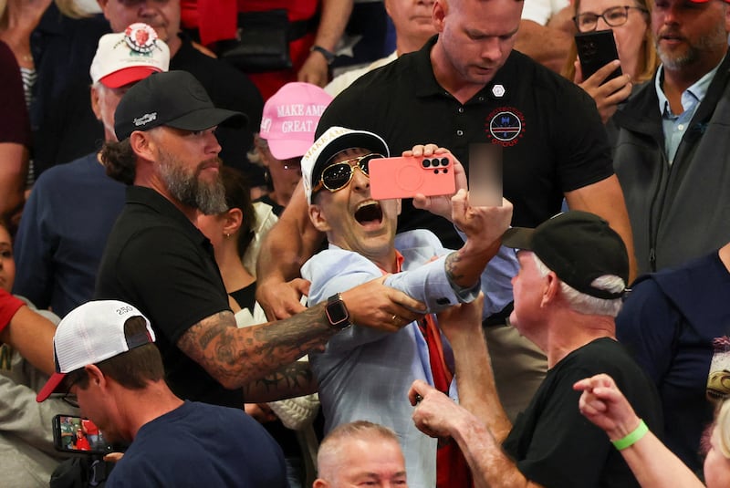 A protester is removed from a campaign rally hosted by US President Donald Trump for US Senator Jon Husted (R-OH) and gubernatorial candidate Vivek Ramaswamy, in Chillicothe, Ohio, US, October 28, 2026.