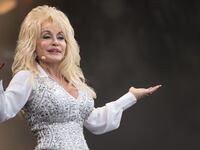 Dolly Parton performs on the Pyramid Stage during Day 3 of the 2014 Glastonbury Festival at Worthy Farm.