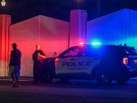 A police car is seen outside former US President Donald Trump's residence in Mar-A-Lago, Palm Beach, Florida