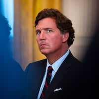 Tucker Carlson sitting down