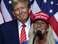 Rep. Marjorie Taylor Greene (R-GA) speaks alongside former US President and 2024 presidential hopeful Donald Trump at a campaign event in Rome, Georgia.