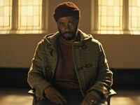 A still from ‘The Changeling’ shows LaKeith Stanfield sitting in a chair with tears in his eyes