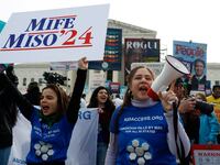 A demonstrator for abortion rights holds a megaphone during a protest outside the U.S. Supreme Court as justices hear oral arguments in a bid by President Joe Biden's administration to preserve broad access to the abortion pill, March 26, 2024.