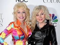HOLLYWOOD, CA - DECEMBER 02: Dolly Parton and Stella Parton attend the premiere of "Dolly Parton's Coat Of Many Colors" at the Egyptian Theatre on December 2, 2015 in Hollywood, California. (Photo by Jason LaVeris/FilmMagic)