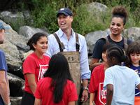 William, Prince of Wales speaks with kids as he visits Billion Oyster Project in New York City.
