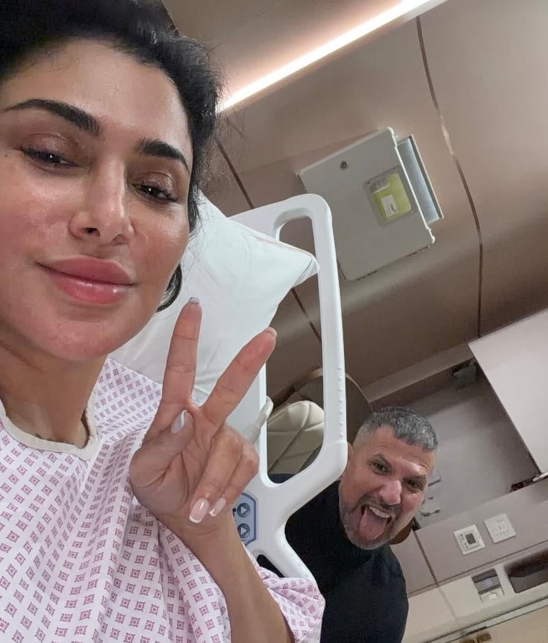 Huda Kattan posted a selfie from her hospital bed with her husband, Christopher Goncalo.