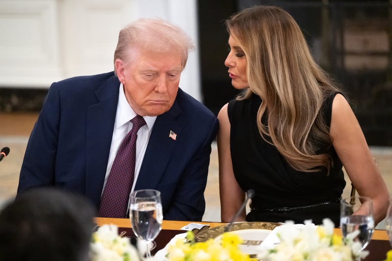 First Lady Melania Trump repeats a question for President Donald Trump from a reporter at a dinner in the State Dining Room of the White House in Washington, DC, on September 4, 2025.