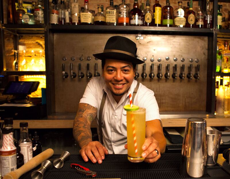 articles/2016/10/21/mamie-taylor-is-the-original-moscow-mule/161020-bartender-with-cocktail-embed-4_v04dmo