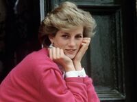 Princess Diana sitting on a front step at her house in 1986.