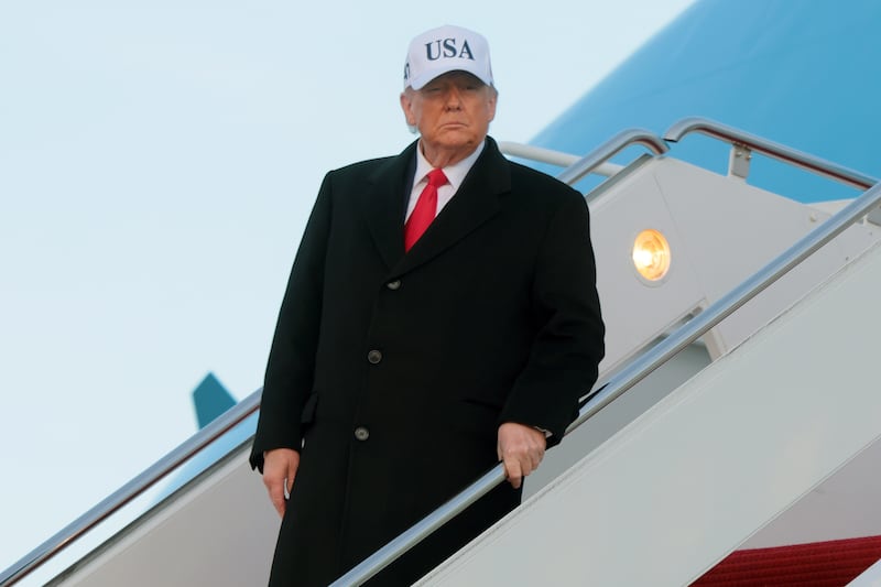 JOINT BASE ANDREWS, MARYLAND - JANUARY 13: U.S. President Donald Trump walks down the air stairs after landing on Air Force One on January 13, 2026 at Joint Base Andrews, Maryland. Trump spent the day in Detroit participating in a tour of the Ford River Rouge complex and speaking at the Detroit Economic Club. (Photo by Anna Moneymaker/Getty Images)
