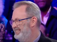 François Vérove laughs while appearing on a TV show.
