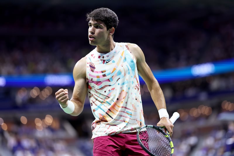 Image: Carlos Alcaraz of Spain celebrates a point against Dominik Koepfer of Germany during their Men's Singles First Round match on Day Two of the 2023 US Open in New York City.