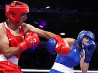 Imane Khelif lands a punch on Angela Carini at the Paris Olympics.