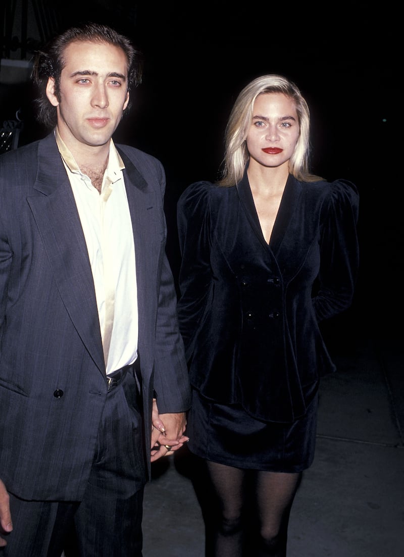 Nicolas Cage and girlfriend Christina Fulton attend Michael Dukakis's Presidential Campaign Fundraiser Party on October 10, 1988, at The Pallett Club in Los Angeles, California.