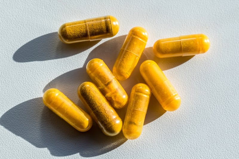 Close-up of turmeric capsules on table, Brussels, Belgium