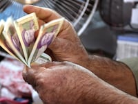 articles/2012/10/04/iran-s-currency-crisis-bad-news-for-mahmoud-ahmadinejad/iran-money-rial-memarian-tease_ylvwgt