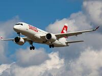 Swiss Airbus A220-300 aircraft or former Bombardier CS300 BD-500 model, as seen on final approach flying for landing at the runway of London Heathrow International Airport LHR.