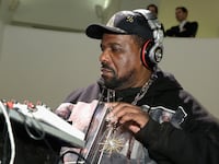 NEW YORK, NY - MARCH 19: DJ Afrika Bambaataa performs during the 2015 Guggenheim Young Collectors party supported by David Yurman at Guggenheim Museum on March 19, 2015 in New York City. (Photo by Cindy Ord/Getty Images)