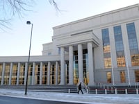 Construction crews put the finishing touches on the new Ralph L. Carr Colorado Judicial Center at 2 East 14th Avenue in Denver