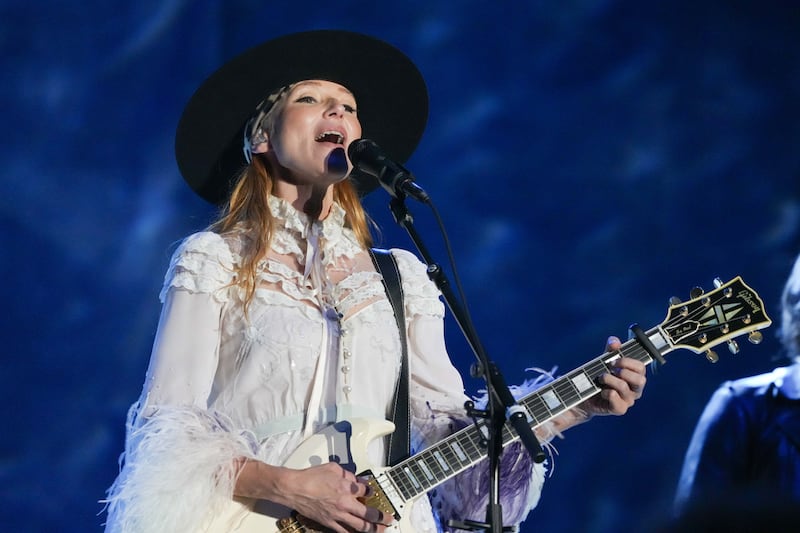 The singer said she was primarily raised by her father, who became "physically abusive."