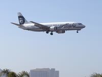 An Alaska Airlines Boeing 737-400 plane is shown on final approach to land in San Diego, California.
