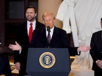 President Donald Trump speaks in Emancipation Hall after being sworn in at his inauguration as US First Lady Melania Trump, Vice President JD Vance, and US House Speaker Mike Johnson, a Republican from Louisiana, look on in the U.S. Capitol Rotunda.