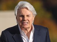 Former Abercrombie & Fitch CEO Mike Jeffries leaves a Long Island court with members of his legal team