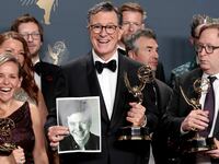 Stephen Colbert with an Emmy.